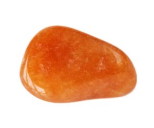 Natural semi-precious bright orange carnelian stone isolated on white background